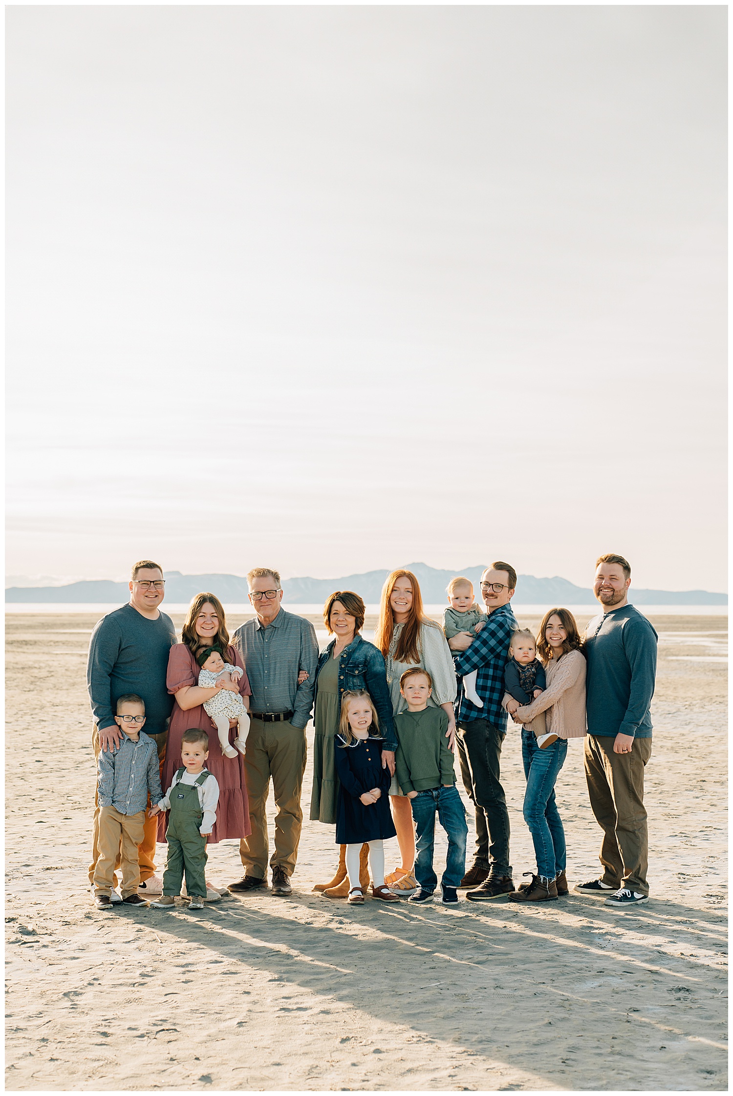 Extended family photography of a set of grandparents, lots of little kids and couples at Saltair. 